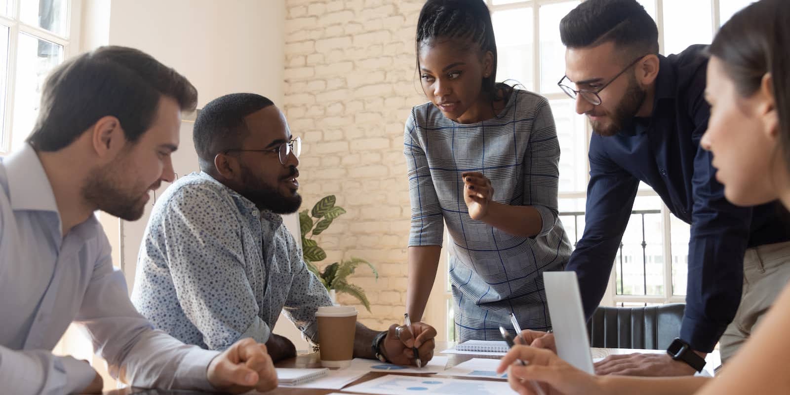 Group of people working at table